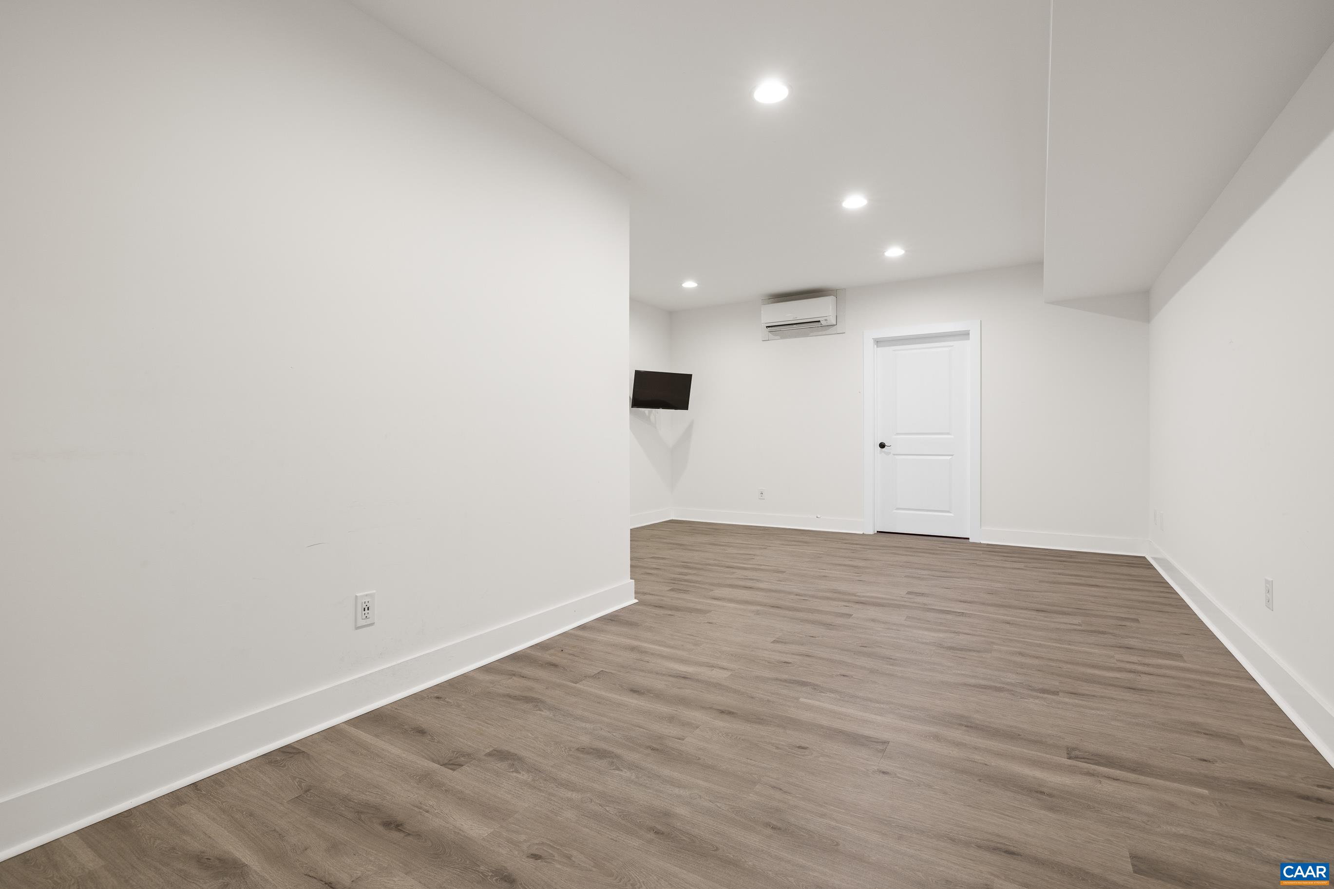 7325 3 Notch Road Louisa, VA 23093 - Photo 53 of 65 a view of an empty room with wooden floor