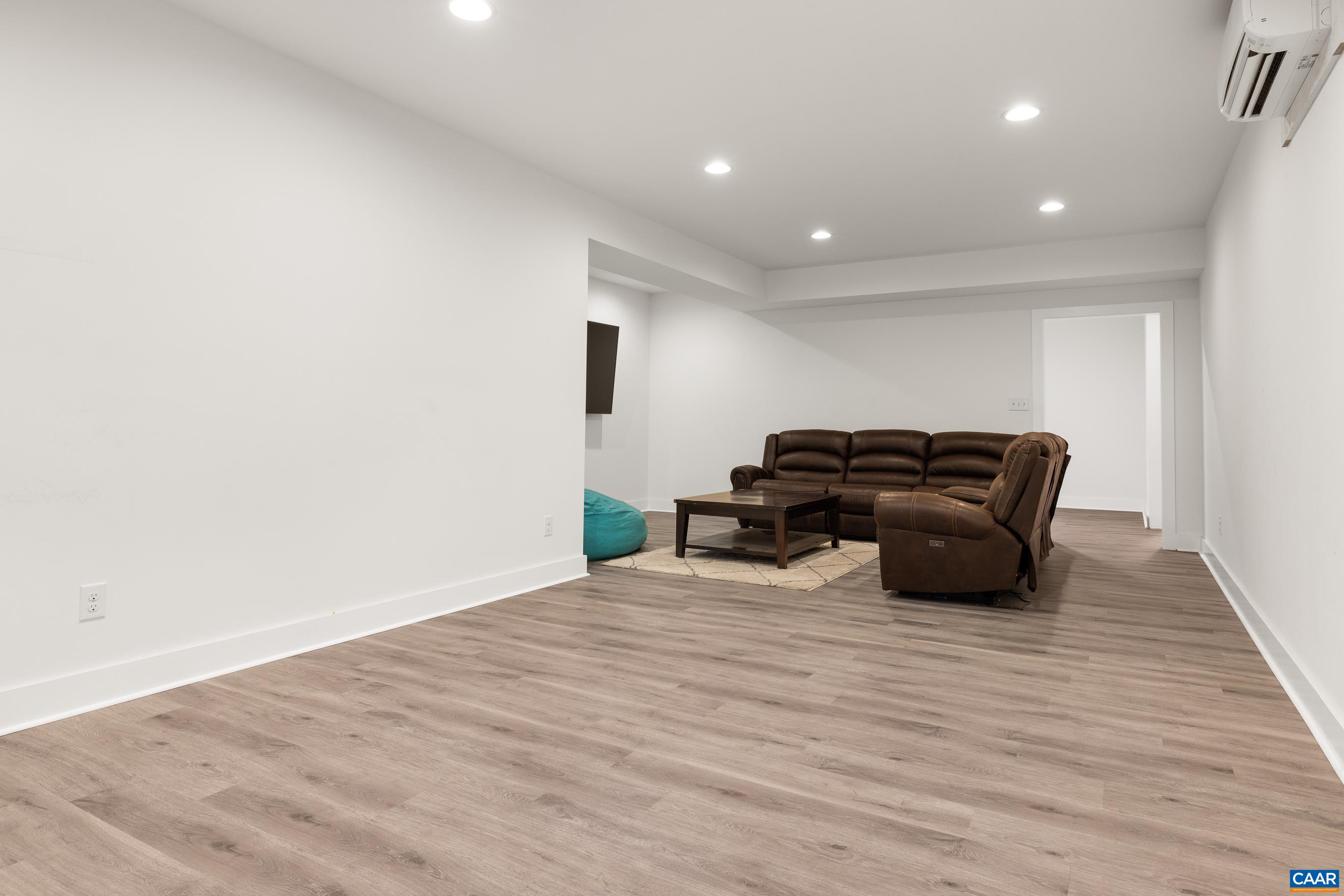 7325 3 Notch Road Louisa, VA 23093 - Photo 55 of 65 a view of a livingroom with furniture and wooden floor