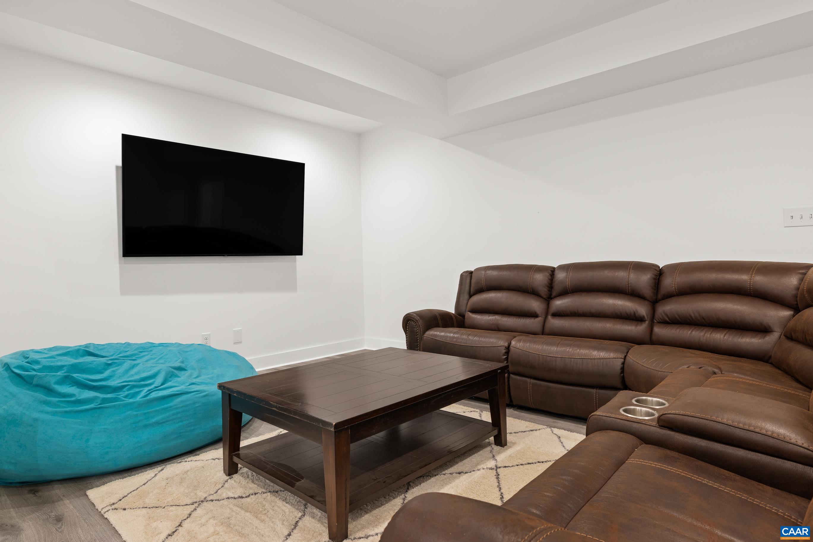 7325 3 Notch Road Louisa, VA 23093 - Photo 56 of 65 a living room with furniture and a flat screen tv