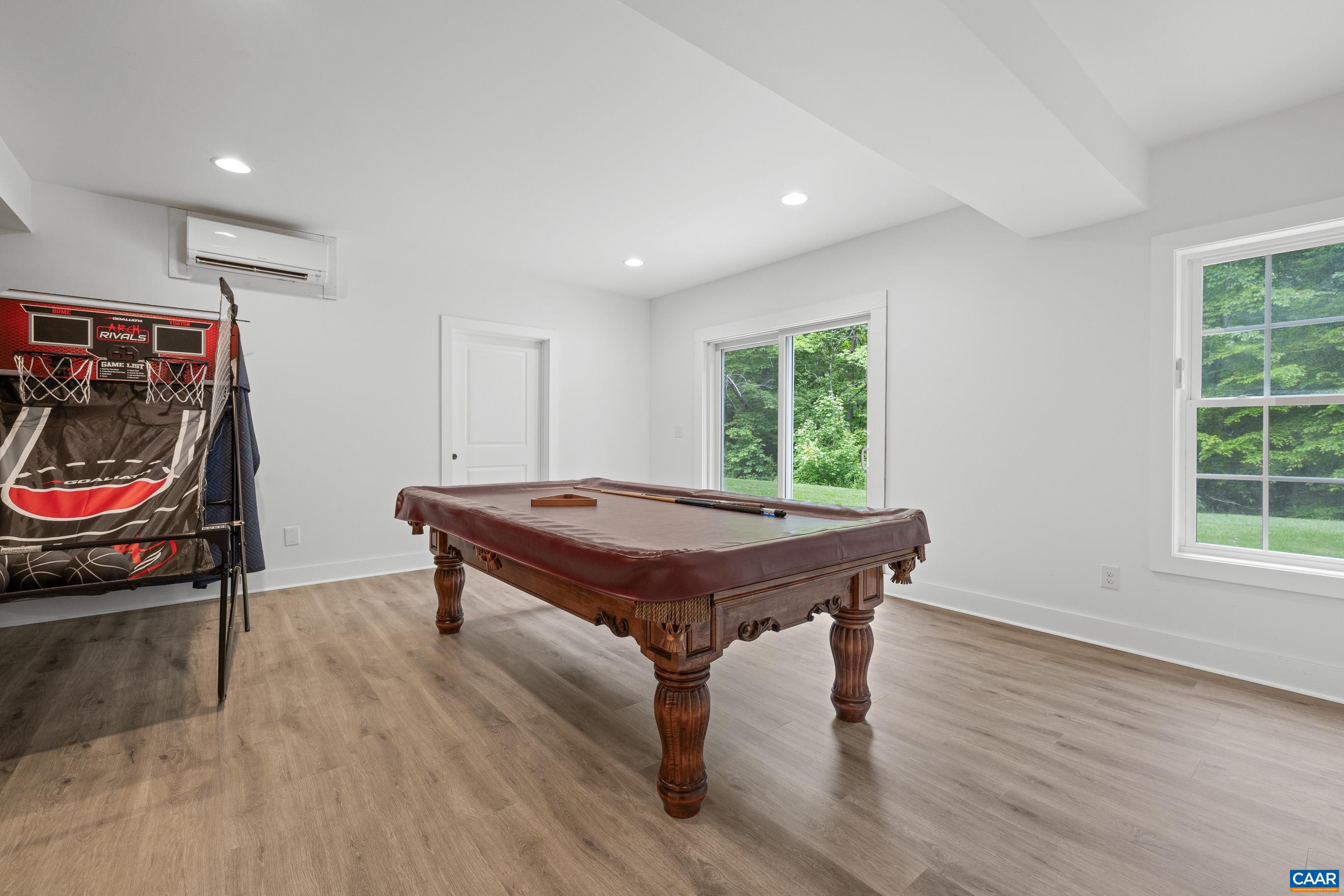 7325 3 Notch Road Louisa, VA 23093 - Photo 58 of 65 a room with wooden floor pool table and windows