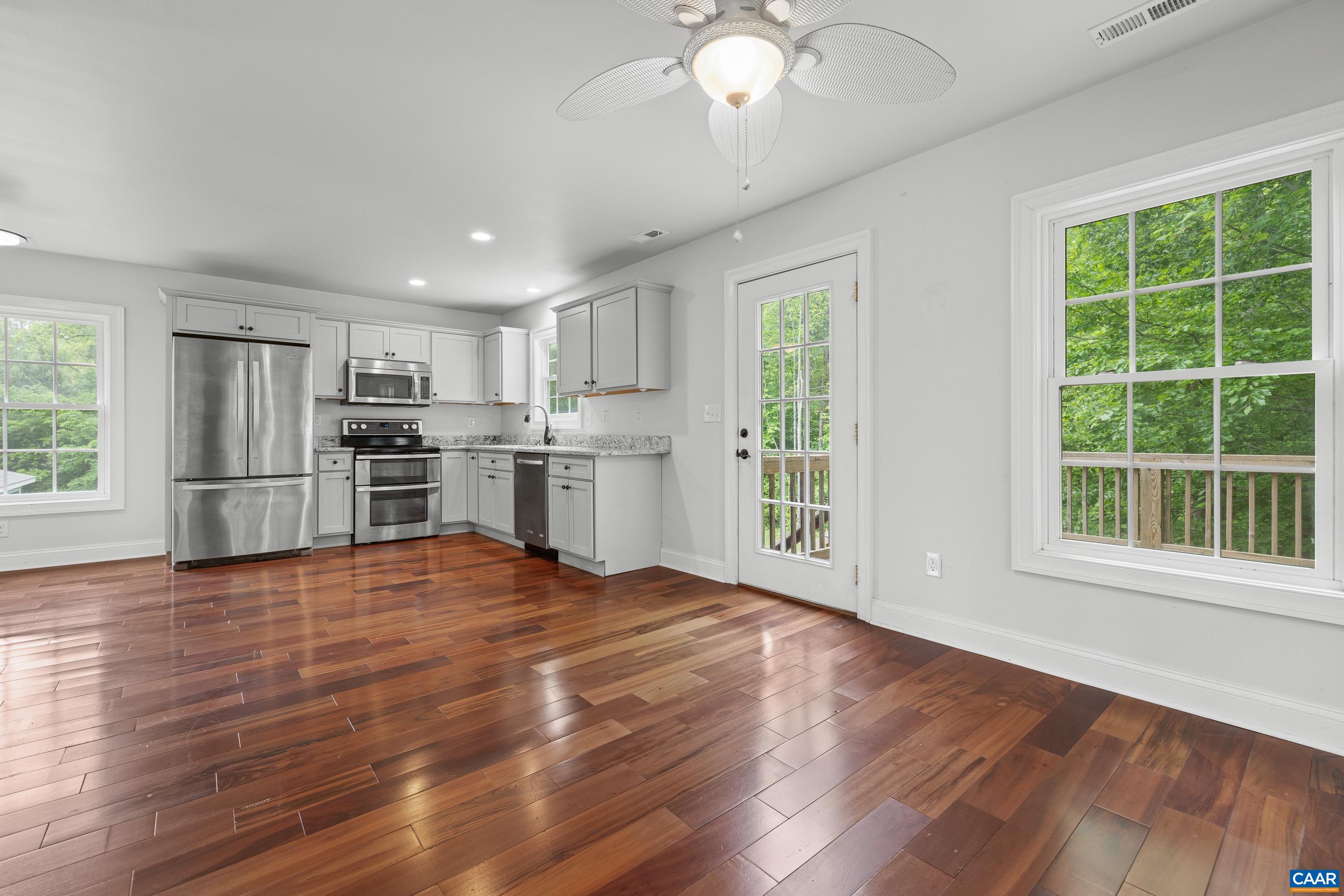 7325 3 Notch Road Louisa, VA 23093 - Photo 59 of 65 a view of a kitchen with a stove cabinets and wooden floor