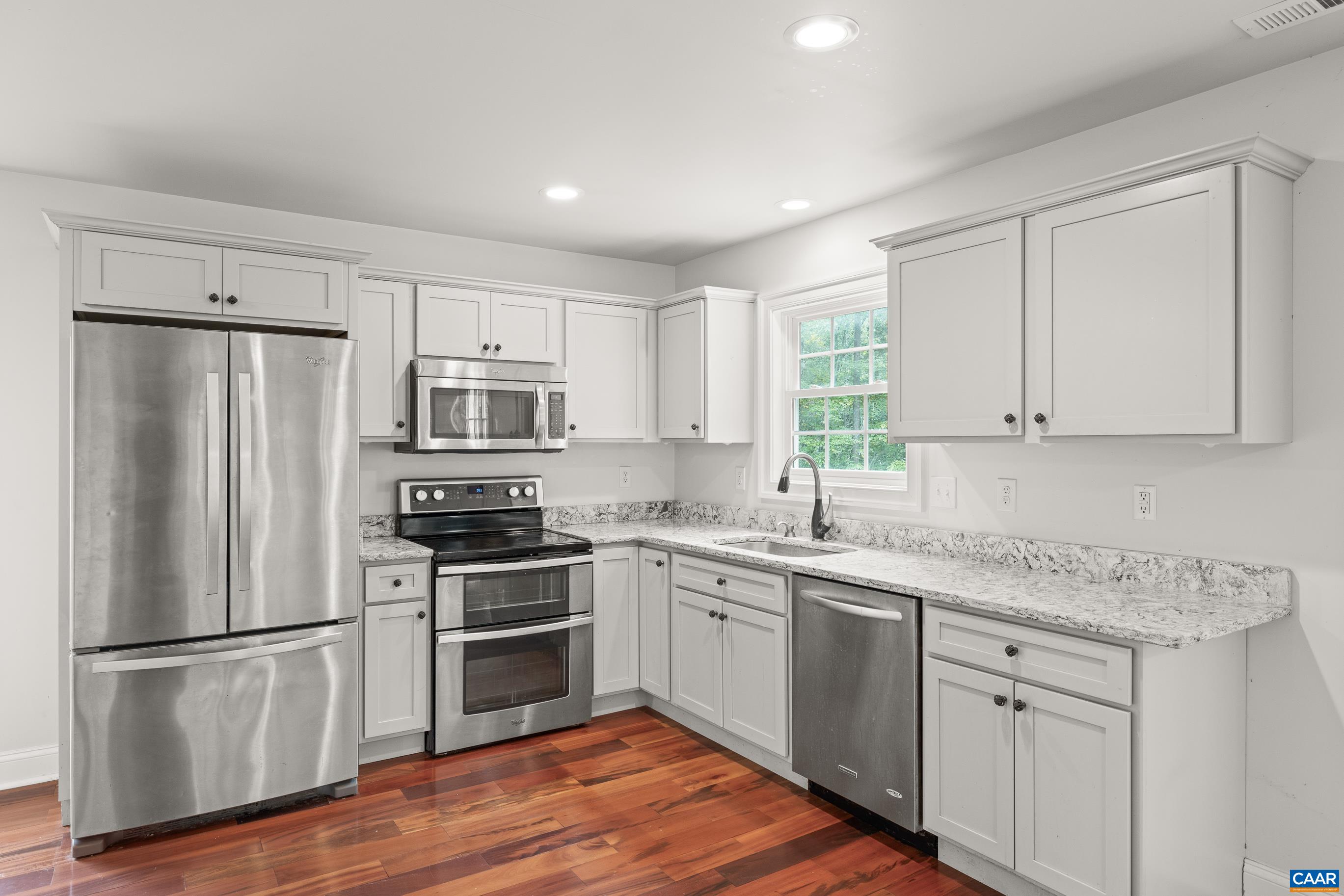 7325 3 Notch Road Louisa, VA 23093 - Photo 61 of 65 a kitchen with a refrigerator stove and sink