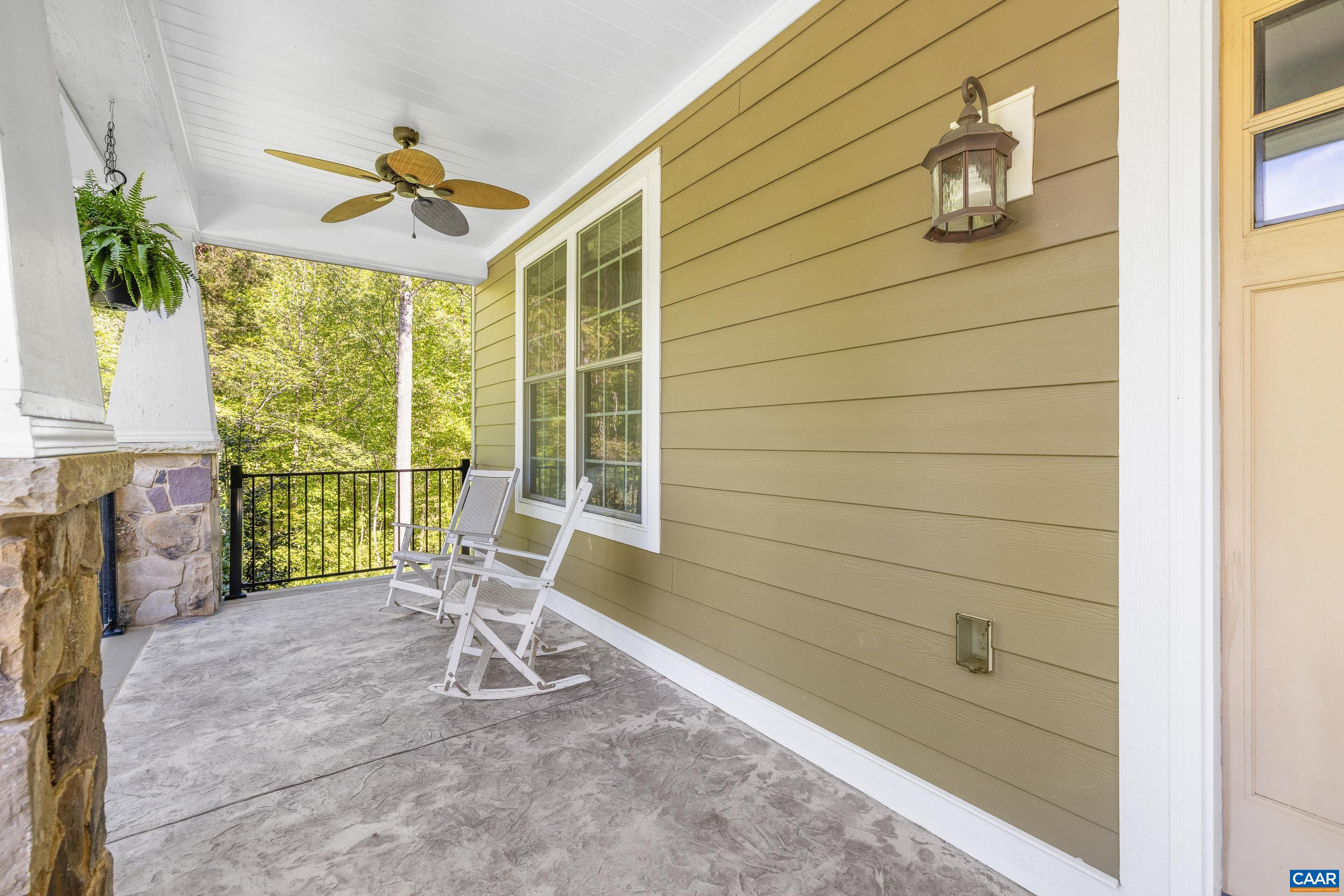 7325 3 Notch Road Louisa, VA 23093 - Photo 7 of 65 a view of a chair and table in the balcony