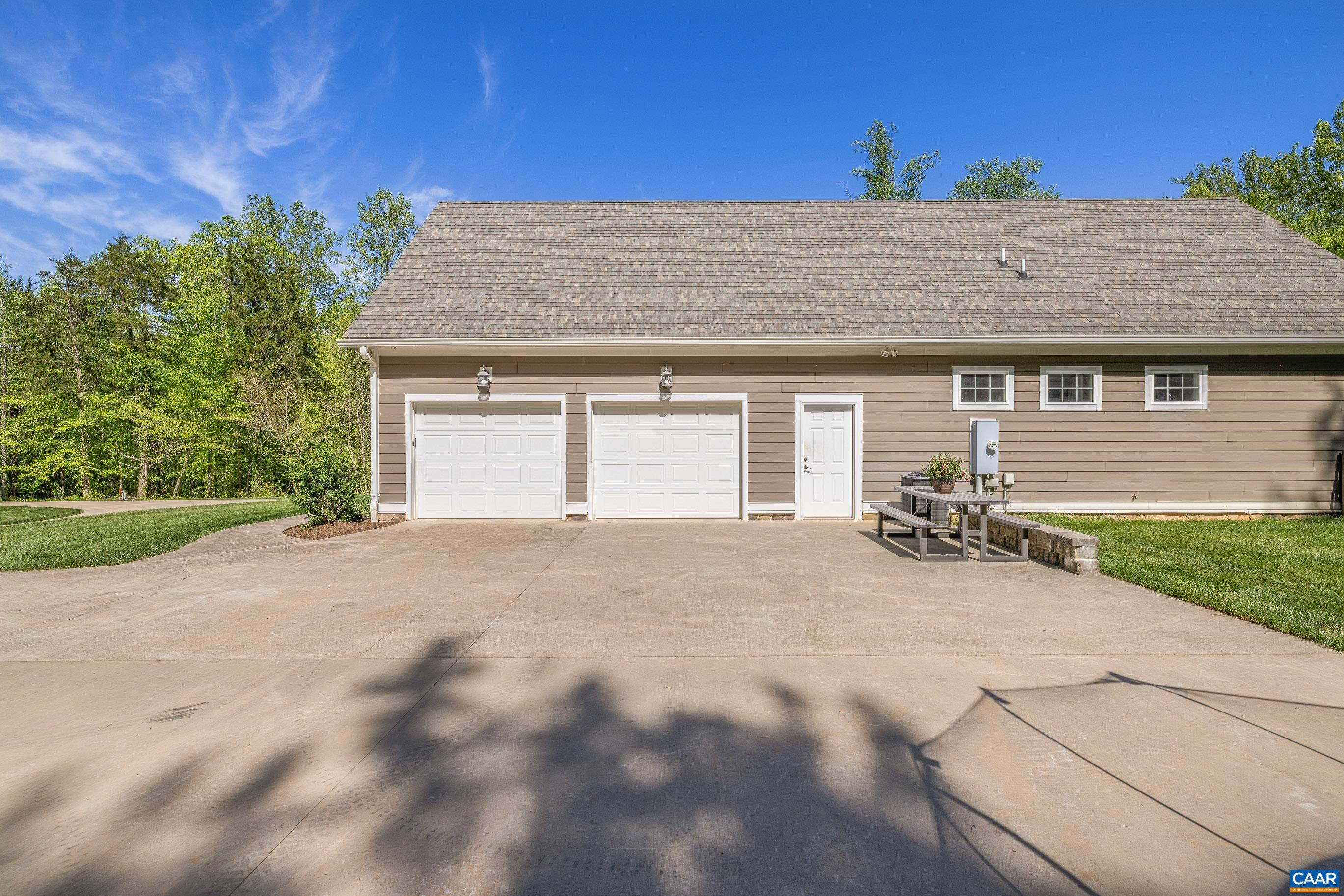 7325 3 Notch Road Louisa, VA 23093 - Photo 10 of 65 a view of a house with a yard and garage