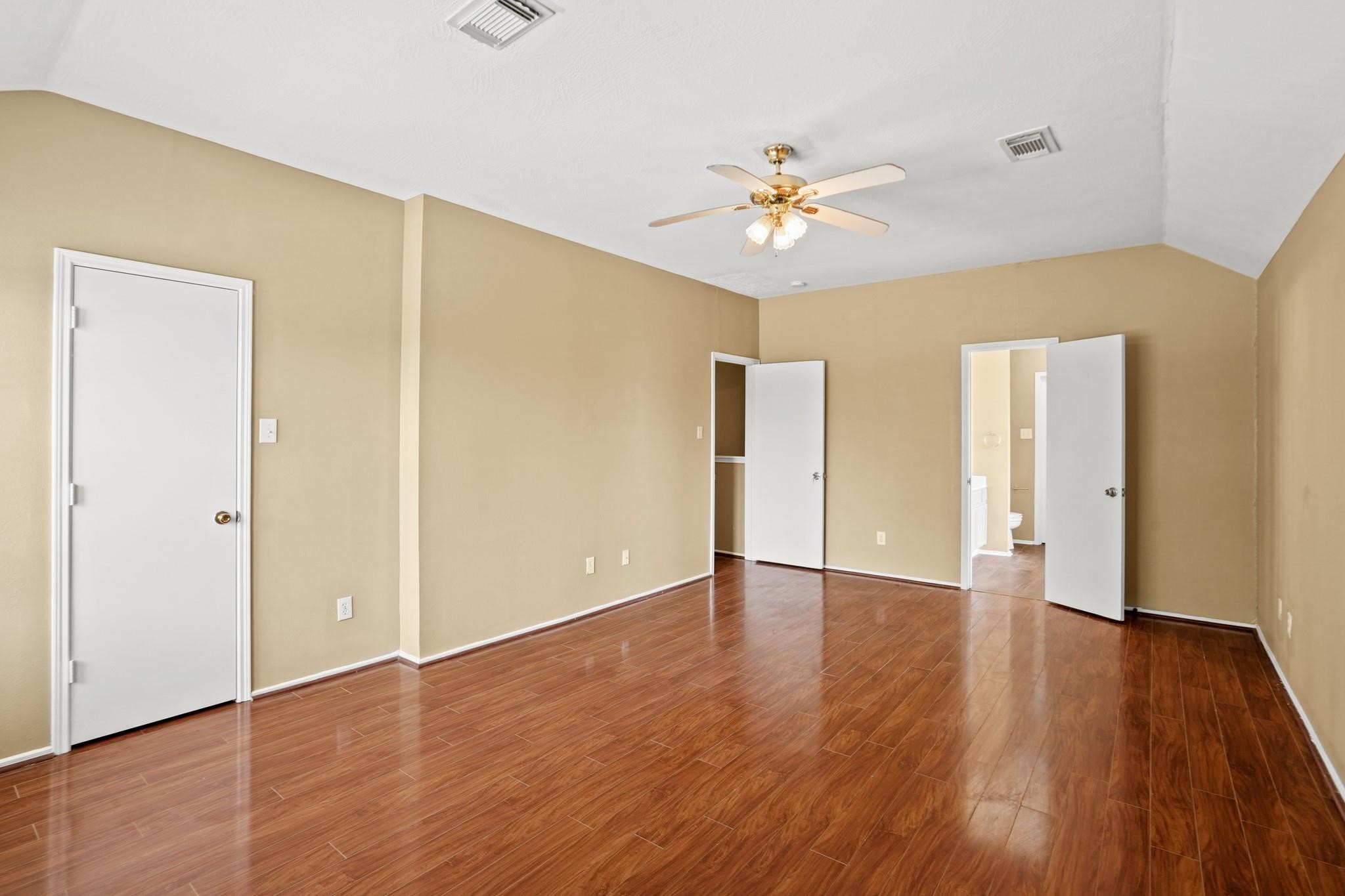 5003 East Parma Drive Rosenberg, TX 77471 - Photo 22 of 25 a view of an empty room with wooden floor
