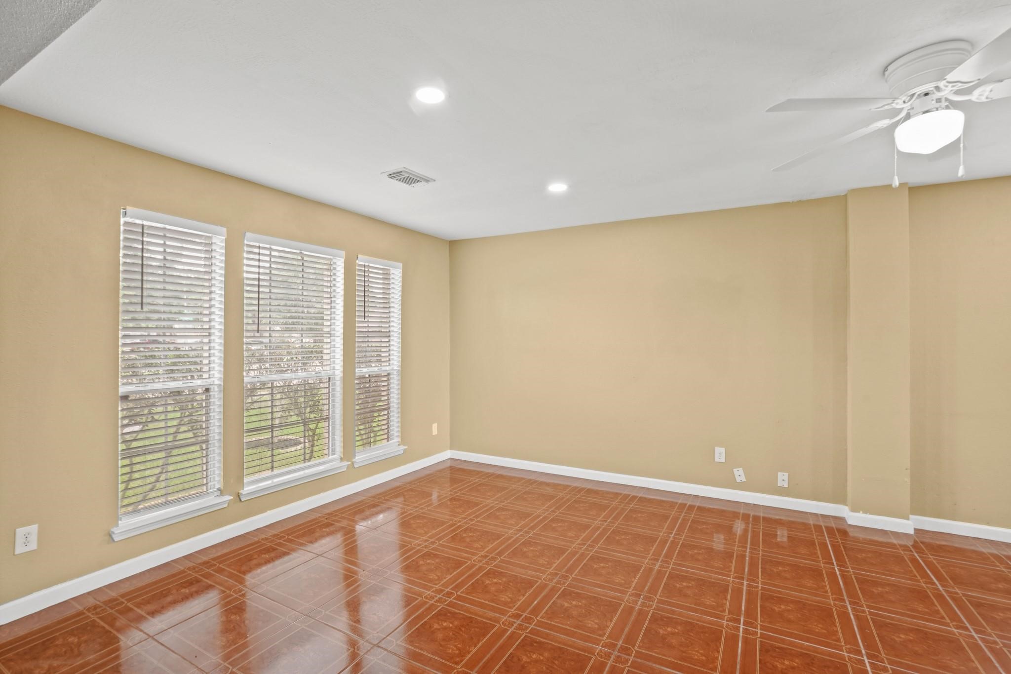 5003 East Parma Drive Rosenberg, TX 77471 - Photo 3 of 25 a view of an empty room with a window