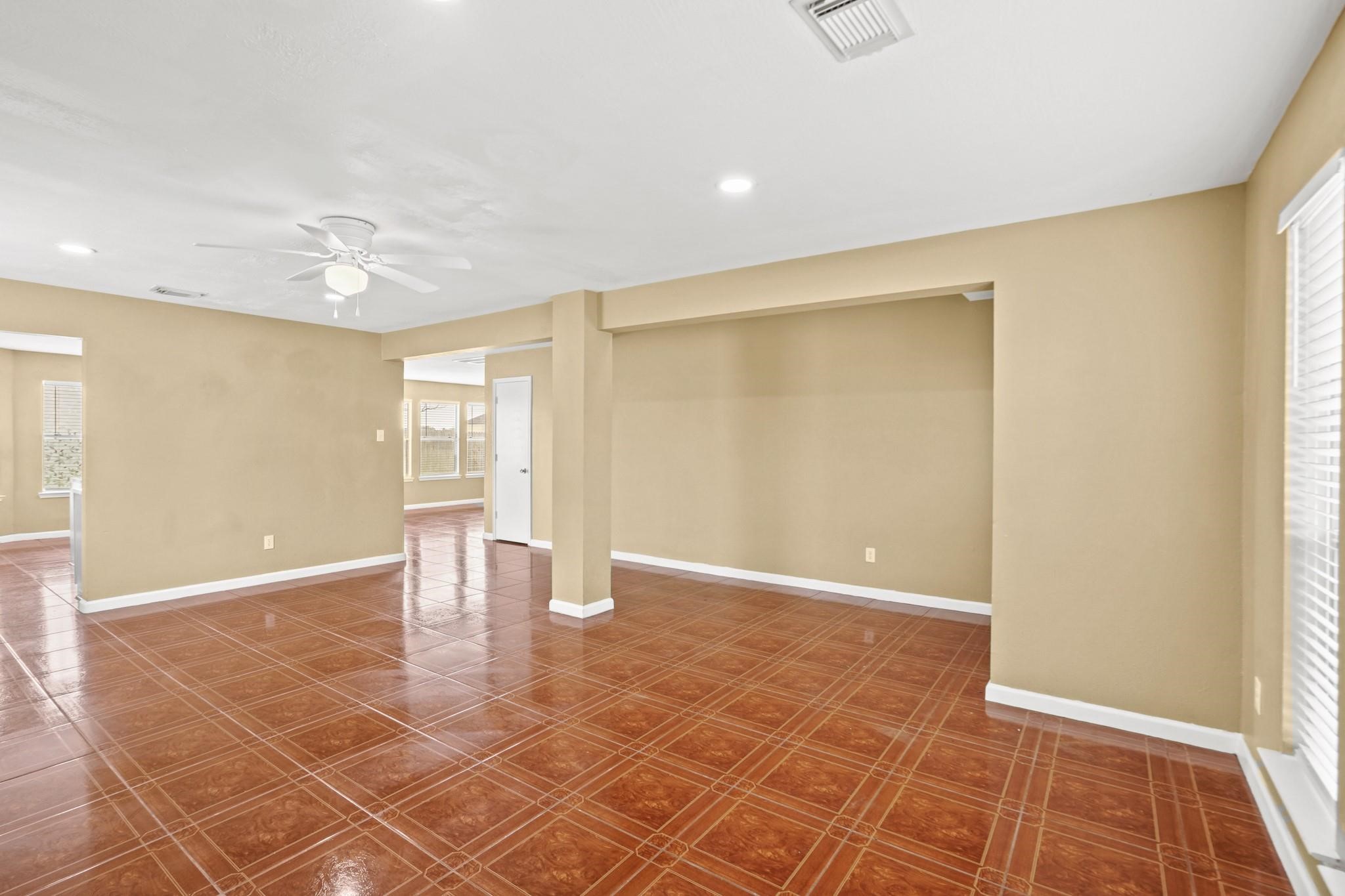 5003 East Parma Drive Rosenberg, TX 77471 - Photo 4 of 25 a view of an empty room with a window