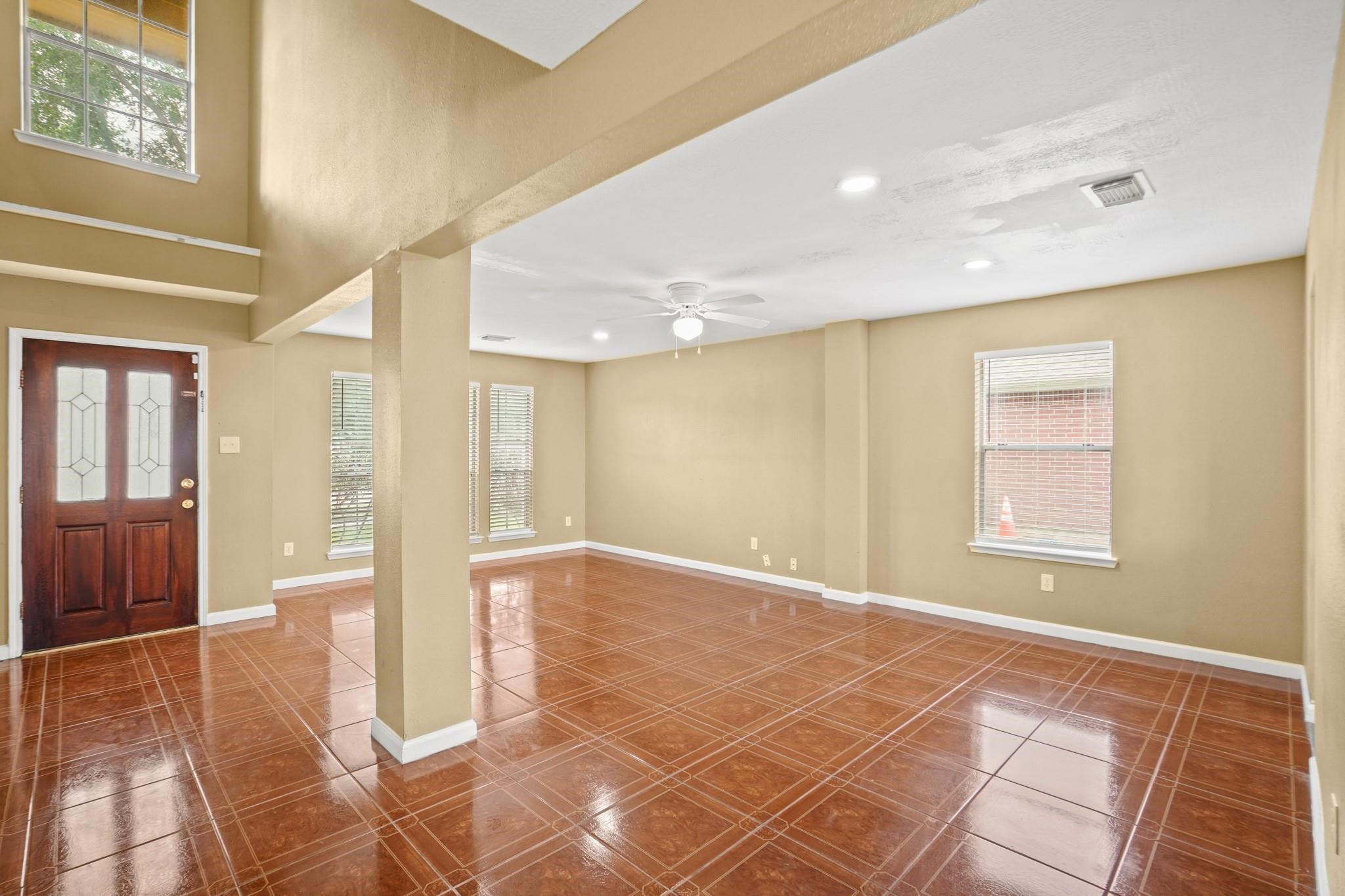 5003 East Parma Drive Rosenberg, TX 77471 - Photo 5 of 25 a view of an empty room with glass door
