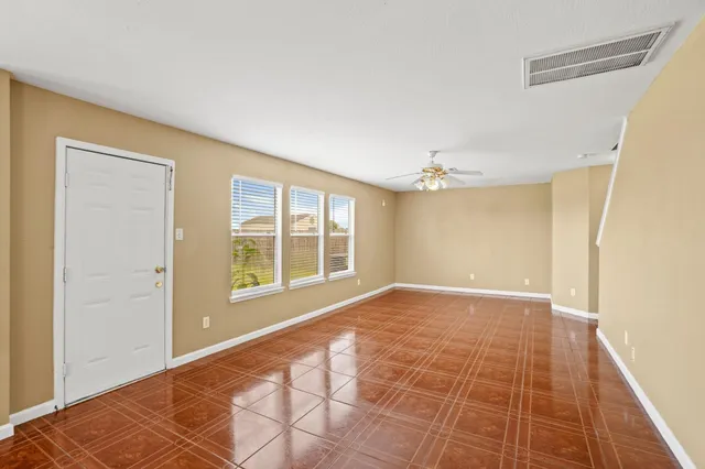 a view of an empty room with a window