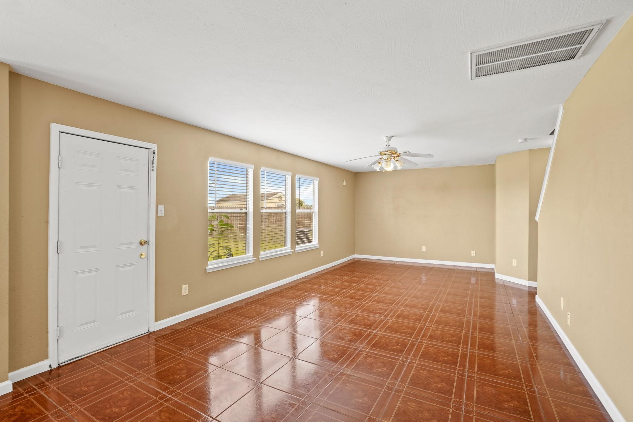 5003 East Parma Drive Rosenberg, TX 77471 - Photo 10 of 25 a view of an empty room with a window