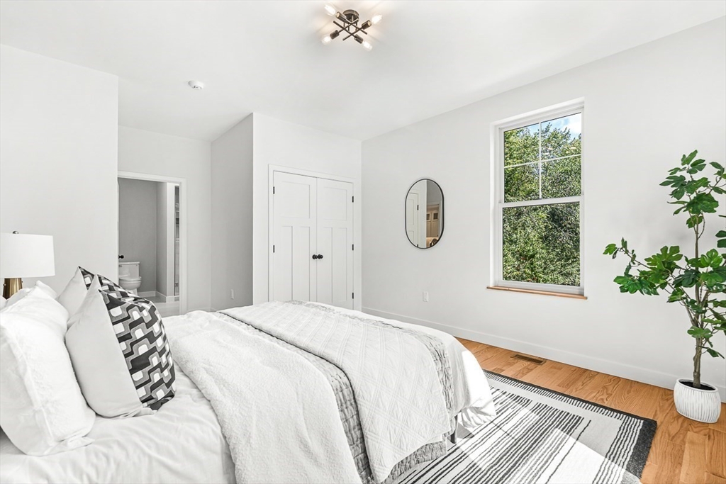 443 Central Avenue Needham, MA 02494 - Photo 20 of 41 a bedroom with a bed and a window