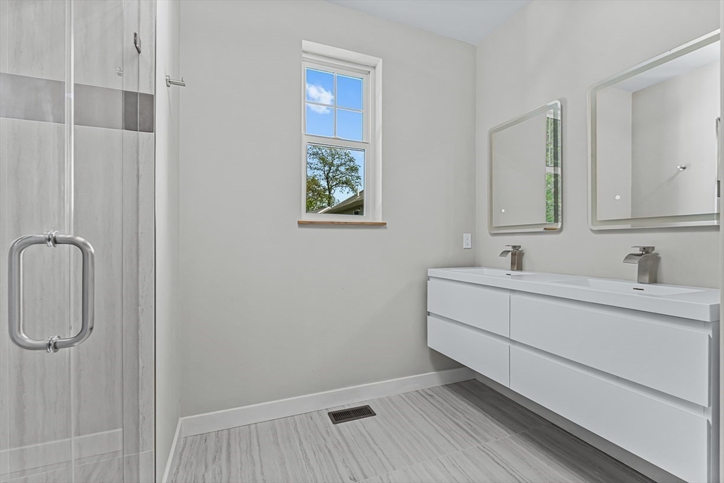 443 Central Avenue Needham, MA 02494 - Photo 21 of 41 a bathroom with a sink and a mirror