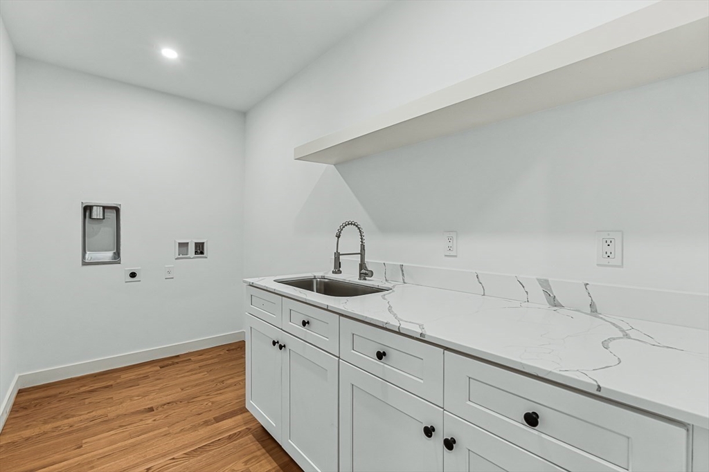 443 Central Avenue Needham, MA 02494 - Photo 22 of 41 a kitchen with a sink and cabinets