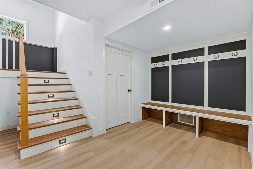 443 Central Avenue Needham, MA 02494 - Photo 34 of 41 a view of an empty room with stairs and furniture