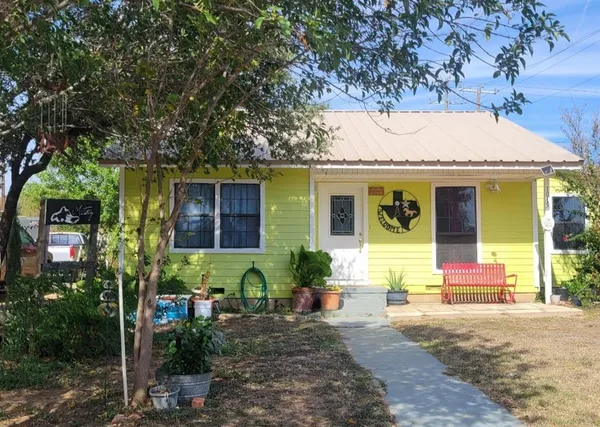 a front view of house with outdoor space