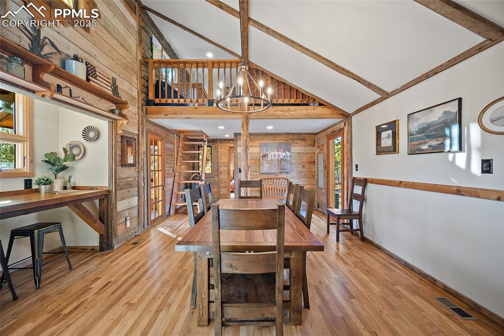 11855 Grandin Point Elbert, CO 80106 - Photo 15 of 42 a view of a dining room with furniture window and wooden floor