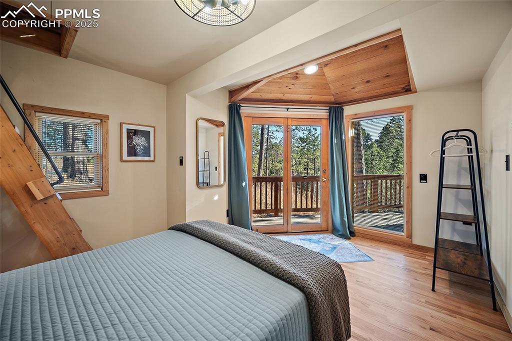 11855 Grandin Point Elbert, CO 80106 - Photo 17 of 42 a bedroom with a bed and a large window