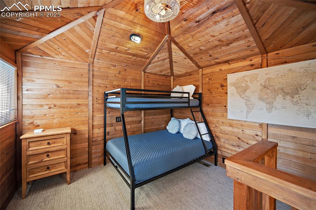 11855 Grandin Point Elbert, CO 80106 - Photo 20 of 42 a bedroom with bunk bed and a dresser