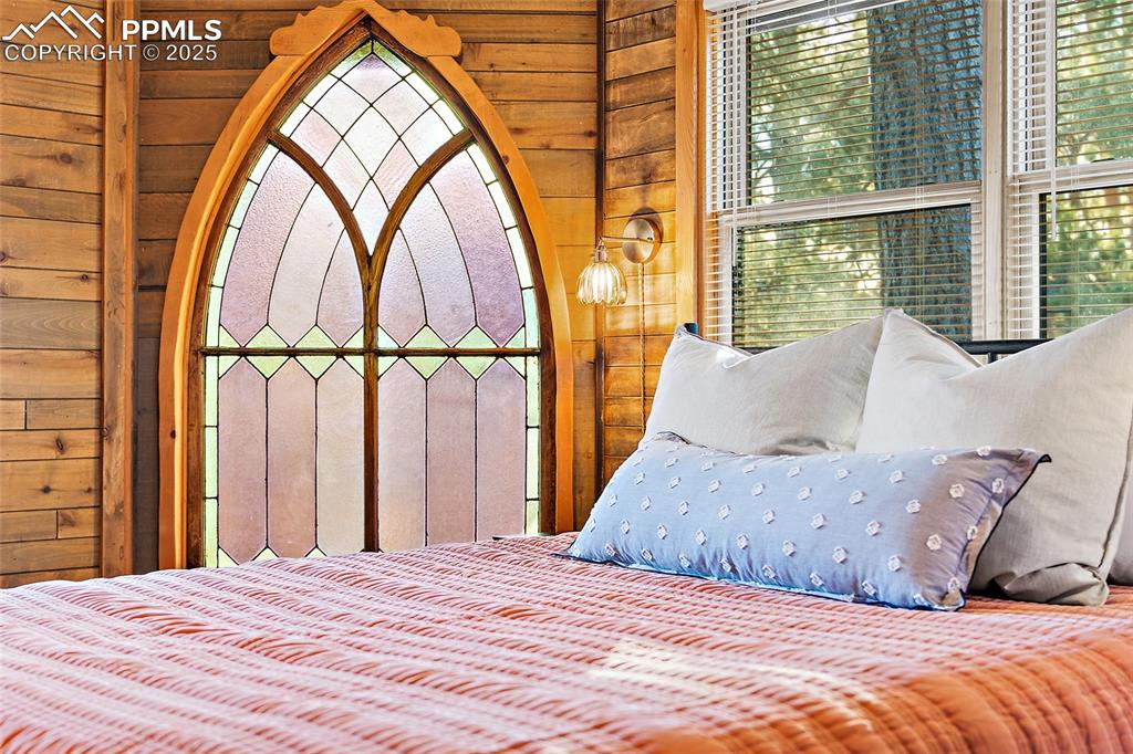 11855 Grandin Point Elbert, CO 80106 - Photo 22 of 42 a bedroom with a large bed and a window