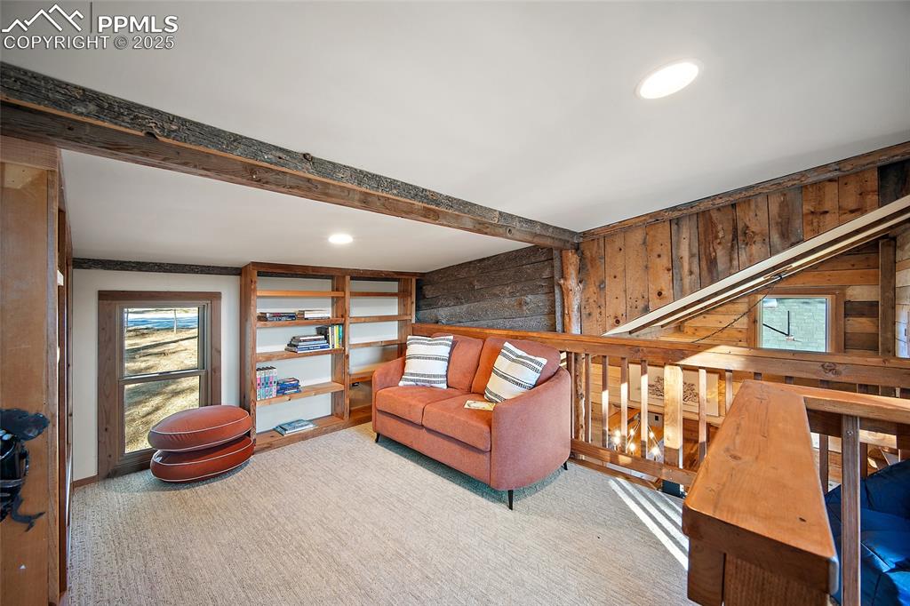 11855 Grandin Point Elbert, CO 80106 - Photo 25 of 42 a living room with furniture a rug and a large window