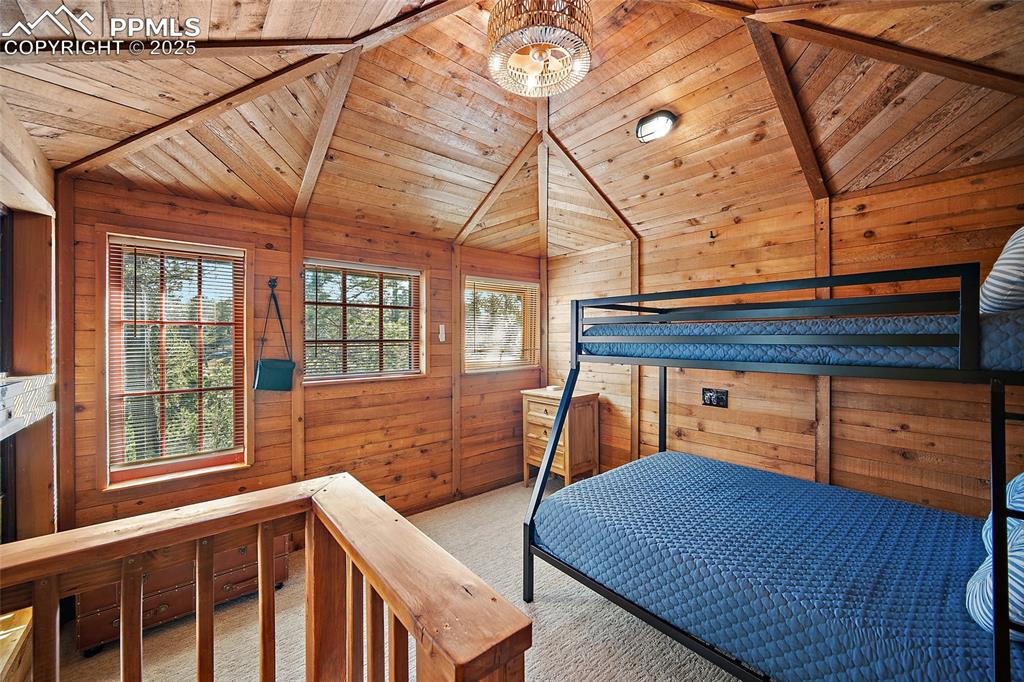 11855 Grandin Point Elbert, CO 80106 - Photo 28 of 42 a bedroom with a bed and a dresser next to a window