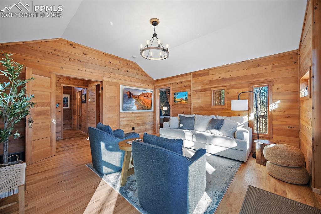 11855 Grandin Point Elbert, CO 80106 - Photo 3 of 42 a living room with fireplace furniture and a wooden floor