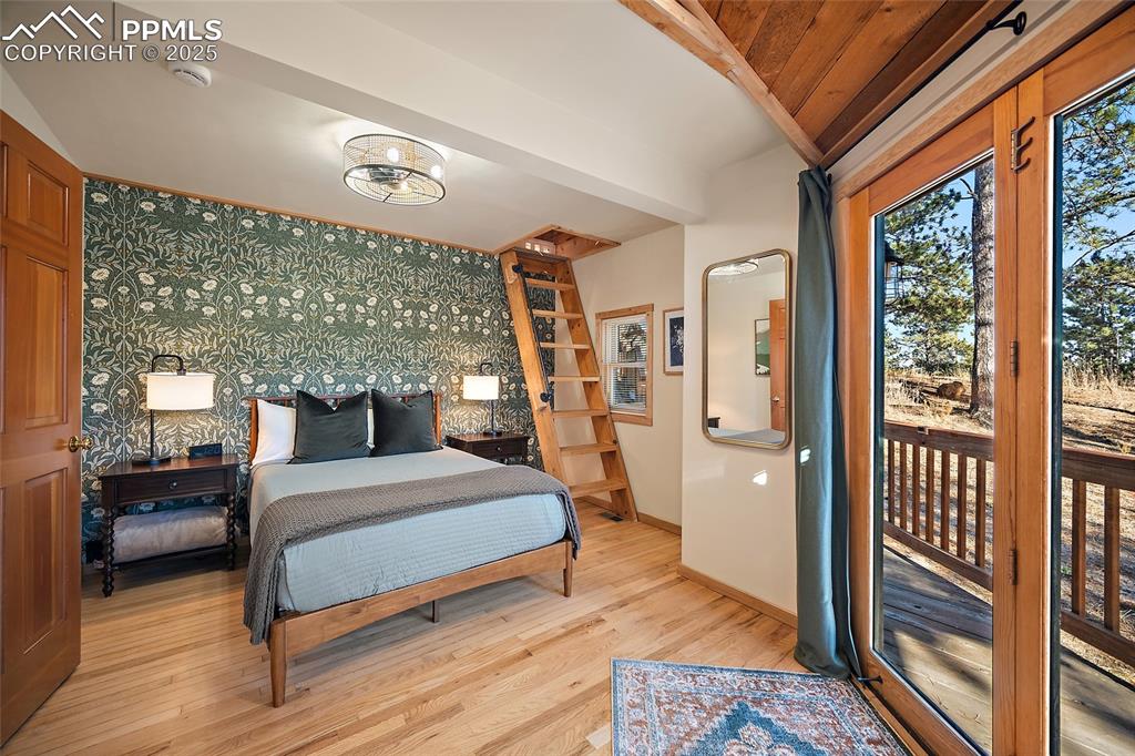 11855 Grandin Point Elbert, CO 80106 - Photo 4 of 42 a bedroom with a large bed and a large window