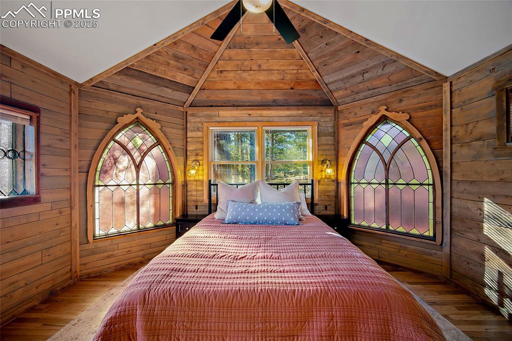 11855 Grandin Point Elbert, CO 80106 - Photo 5 of 42 a bedroom with a bed and a large window with outer view