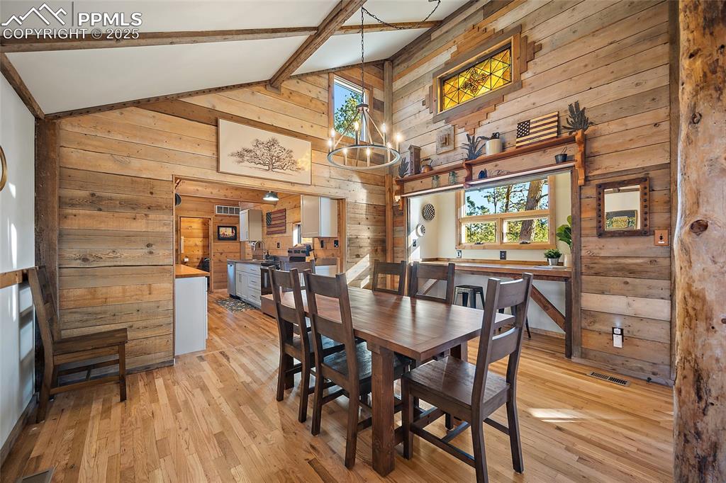 11855 Grandin Point Elbert, CO 80106 - Photo 7 of 42 a view of a dining room with furniture window and wooden floor