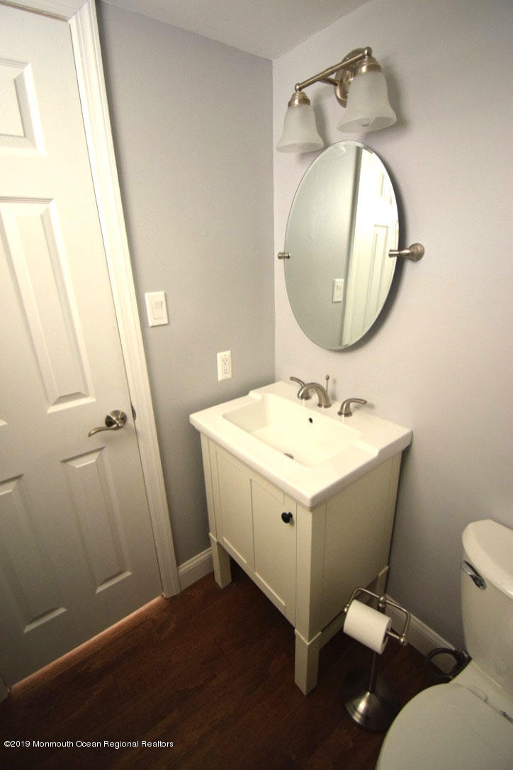 66 Starlight Road Howell, NJ 07731 - Photo 14 of 27 a bathroom with a sink and a mirror