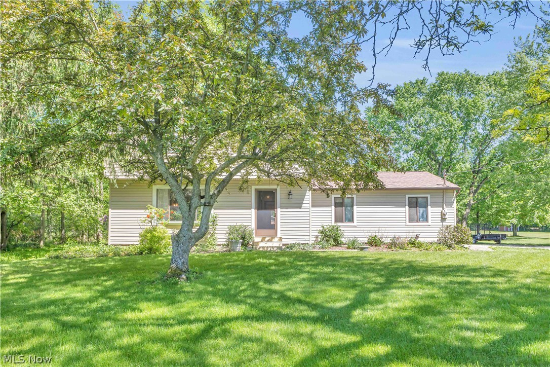 6635 Taylor Road Painesville, OH 44077 - Photo 2 of 41 Ranch-style residence featuring light-colored siding and dark-trimmed windows