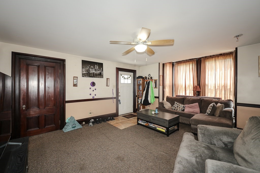 1450 Main Street Athol, MA 01331 - Photo 14 of 42 a living room with furniture gym equipment and a window