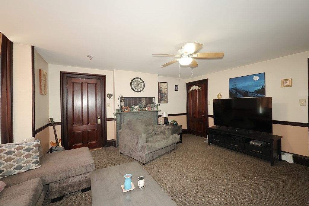1450 Main Street Athol, MA 01331 - Photo 15 of 42 a living room with furniture and a flat screen tv