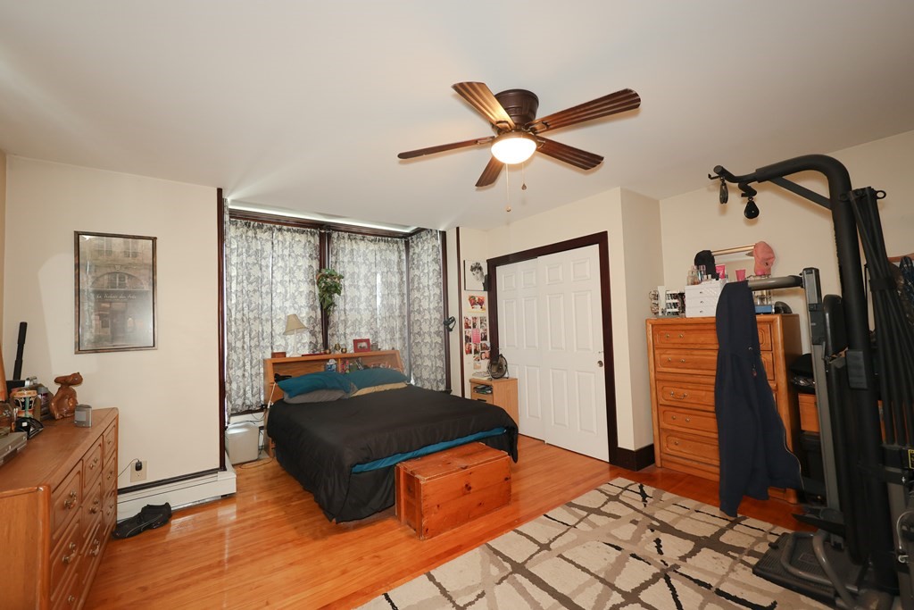 1450 Main Street Athol, MA 01331 - Photo 16 of 42 a bedroom with a bed and a large mirror