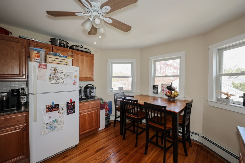 1450 Main Street Athol, MA 01331 - Photo 25 of 42 a kitchen with stainless steel appliances a white table and chairs in it