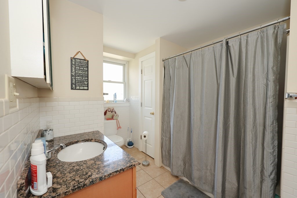 1450 Main Street Athol, MA 01331 - Photo 26 of 42 a bathroom with a granite countertop sink and a mirror