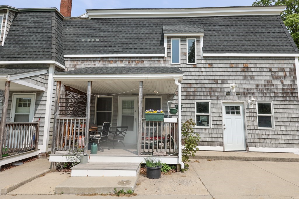 1450 Main Street Athol, MA 01331 - Photo 3 of 42 front view of a brick house with a small yard