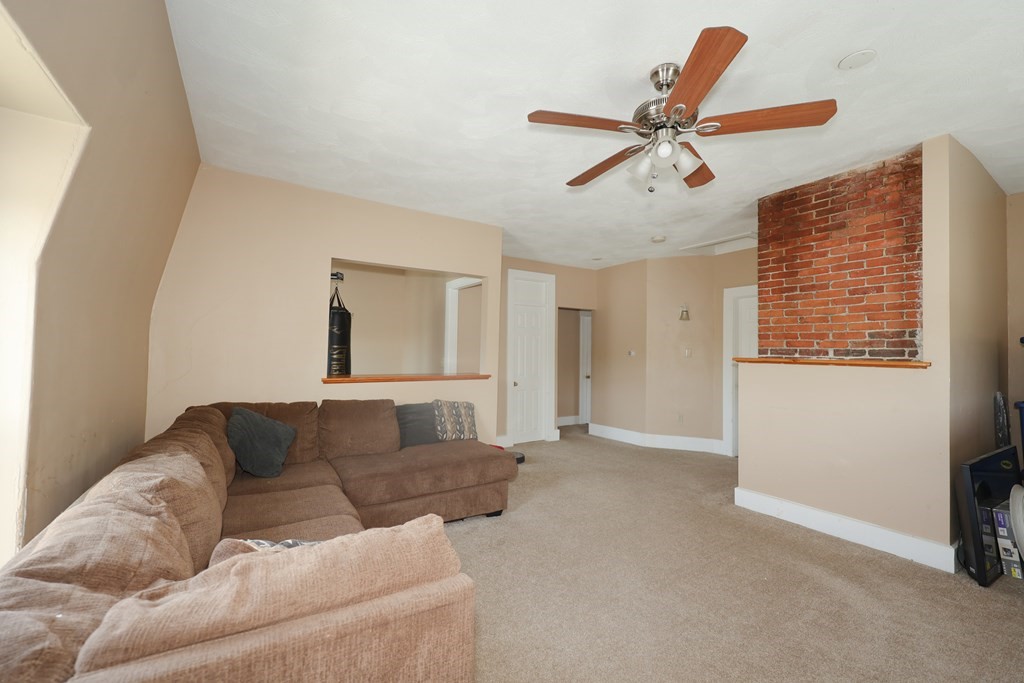1450 Main Street Athol, MA 01331 - Photo 36 of 42 a living room with furniture and a window
