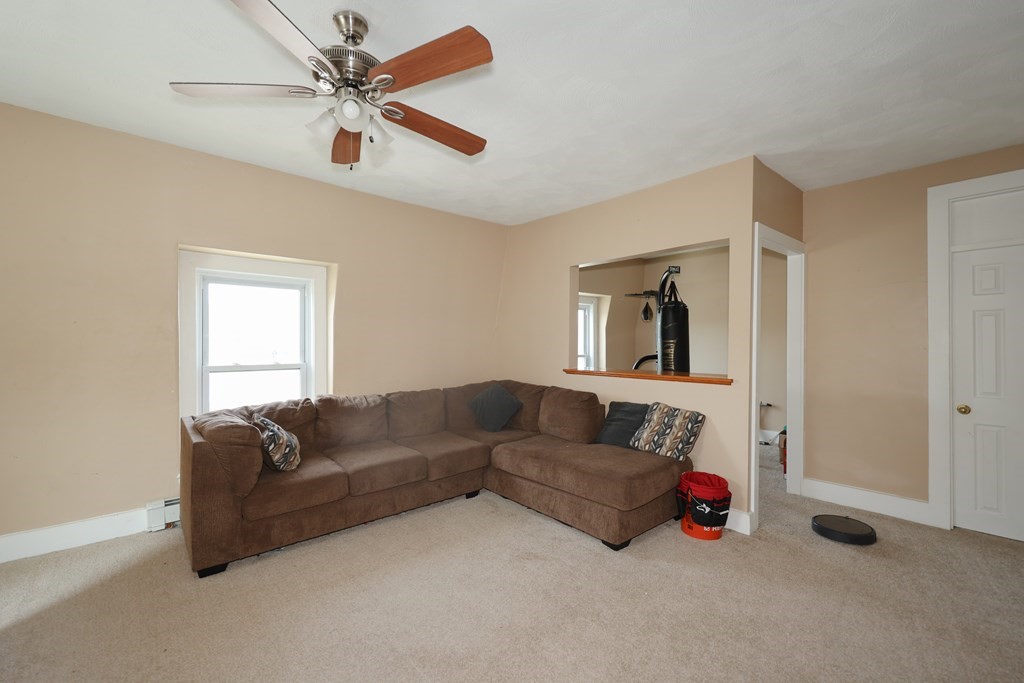 1450 Main Street Athol, MA 01331 - Photo 37 of 42 a living room with furniture and a window