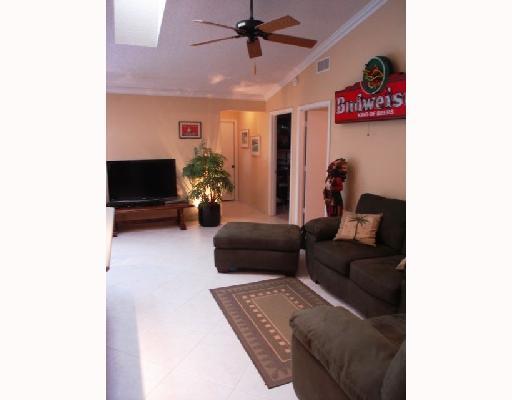 396 Redwood Lane Boca Raton, FL 33487 - Photo 7 of 16 a living room with furniture and a flat screen tv