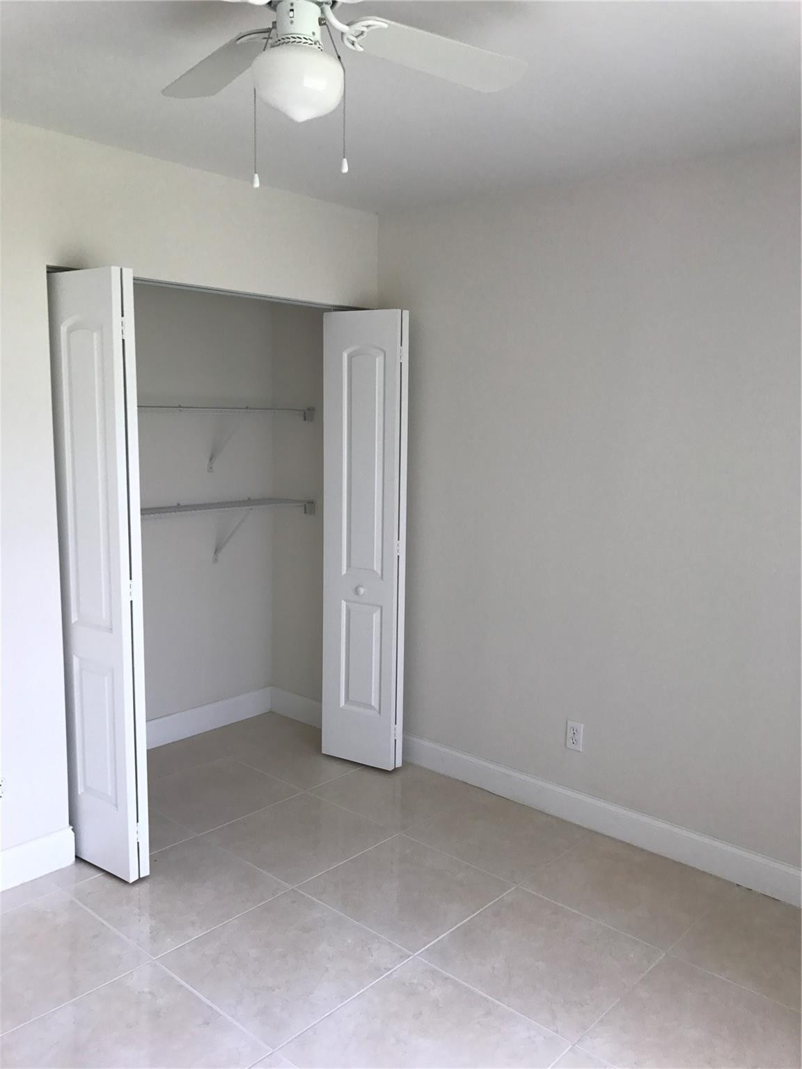 10053 Winding Lake Road, Unit 104 Sunrise, FL 33351 - Photo 11 of 44 an empty room with a empty space