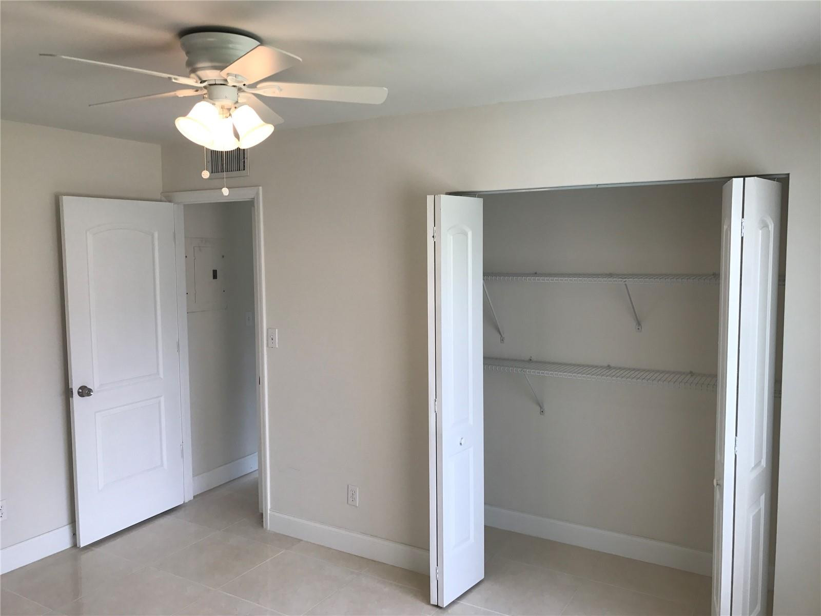 10053 Winding Lake Road, Unit 104 Sunrise, FL 33351 - Photo 17 of 44 a view of a chandelier fan in a room