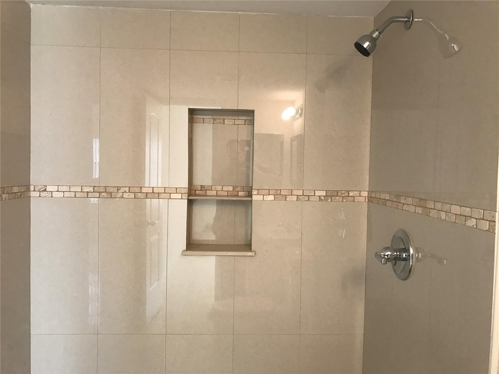 10053 Winding Lake Road, Unit 104 Sunrise, FL 33351 - Photo 23 of 44 a bathroom with a shower