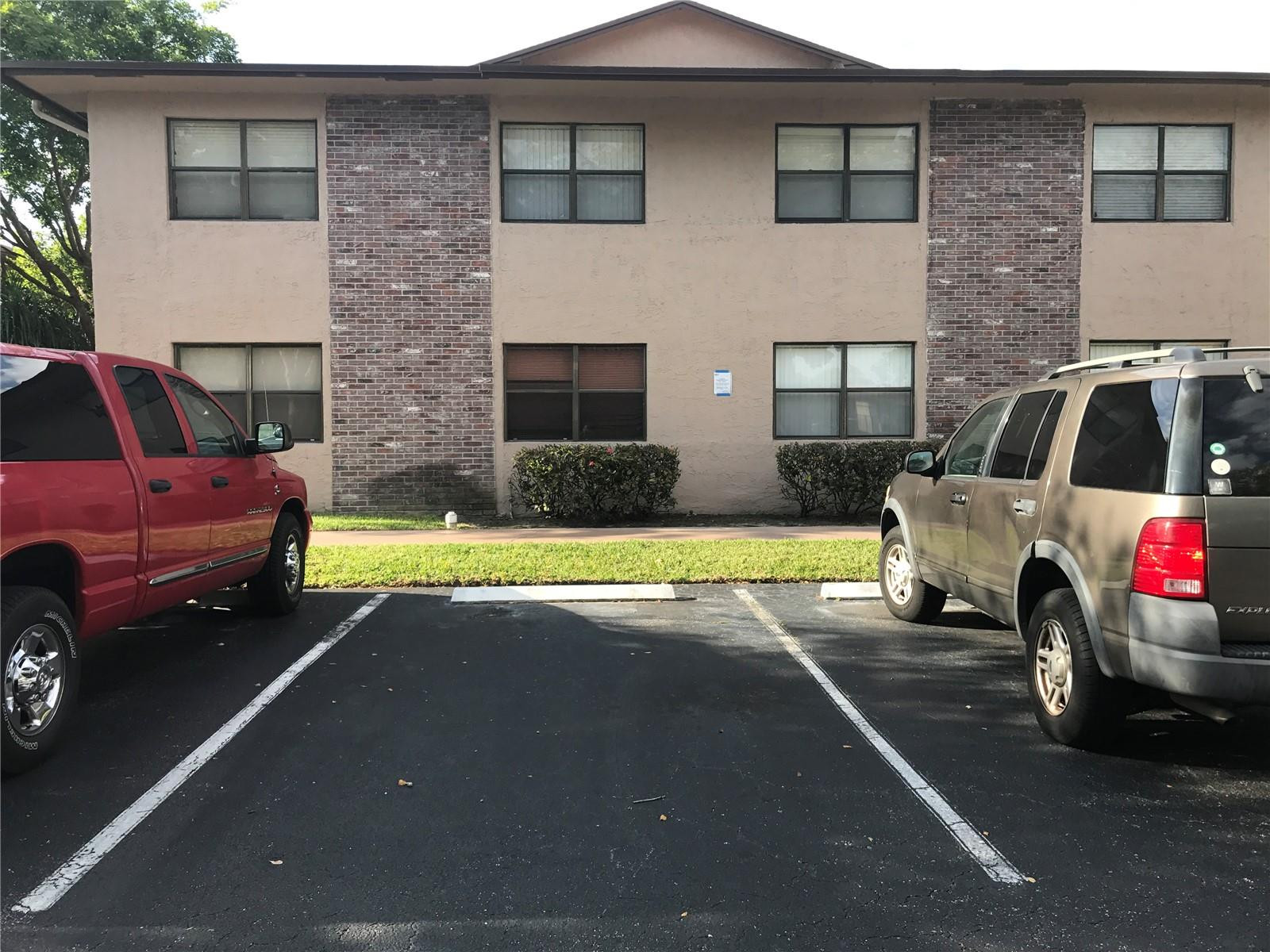 10053 Winding Lake Road, Unit 104 Sunrise, FL 33351 - Photo 25 of 44 a view of a house with a parking space