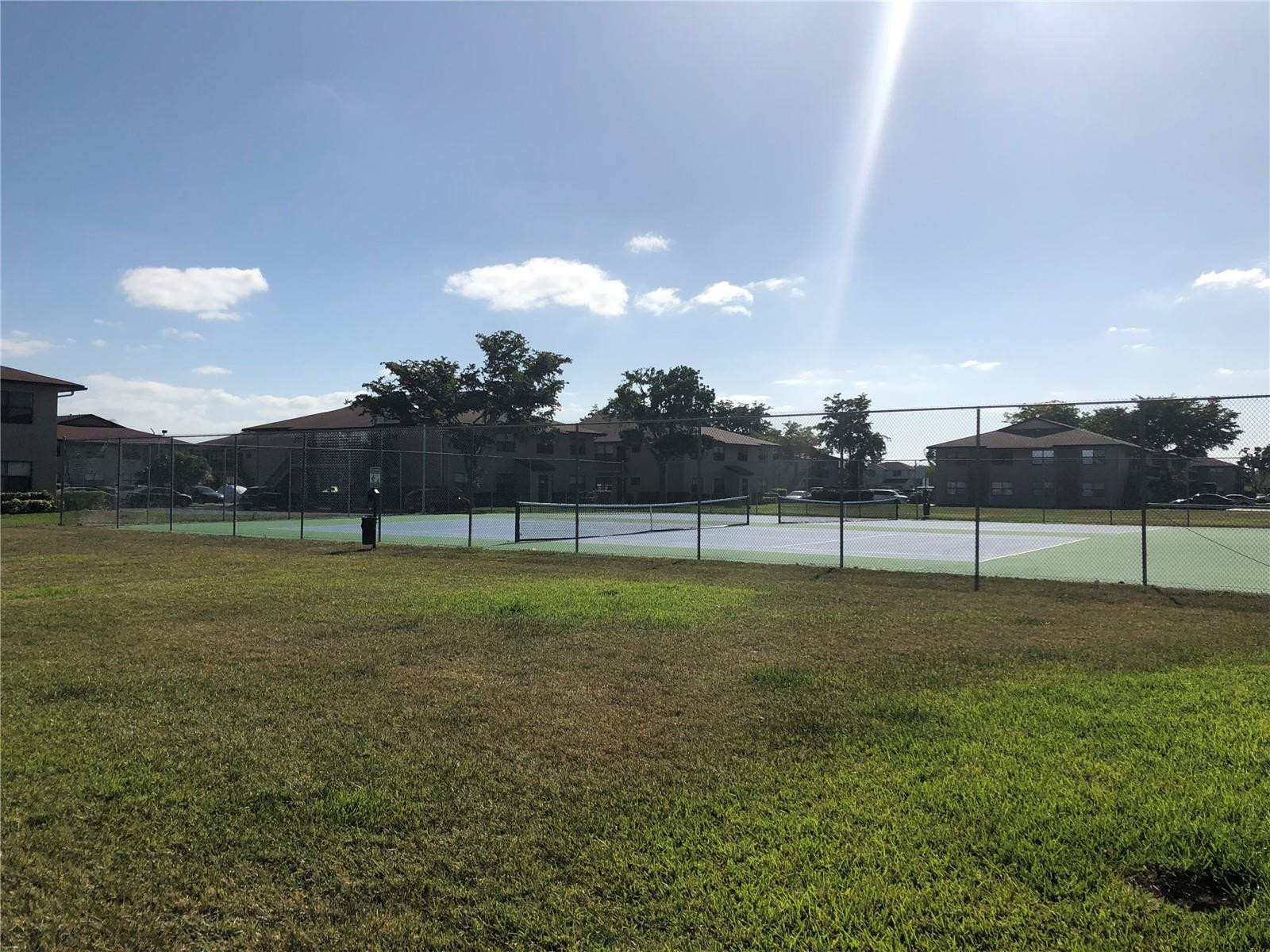 10053 Winding Lake Road, Unit 104 Sunrise, FL 33351 - Photo 34 of 44 a view of a green field