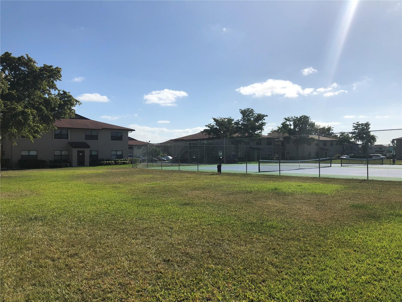 10053 Winding Lake Road, Unit 104 Sunrise, FL 33351 - Photo 36 of 44 a view of a green field
