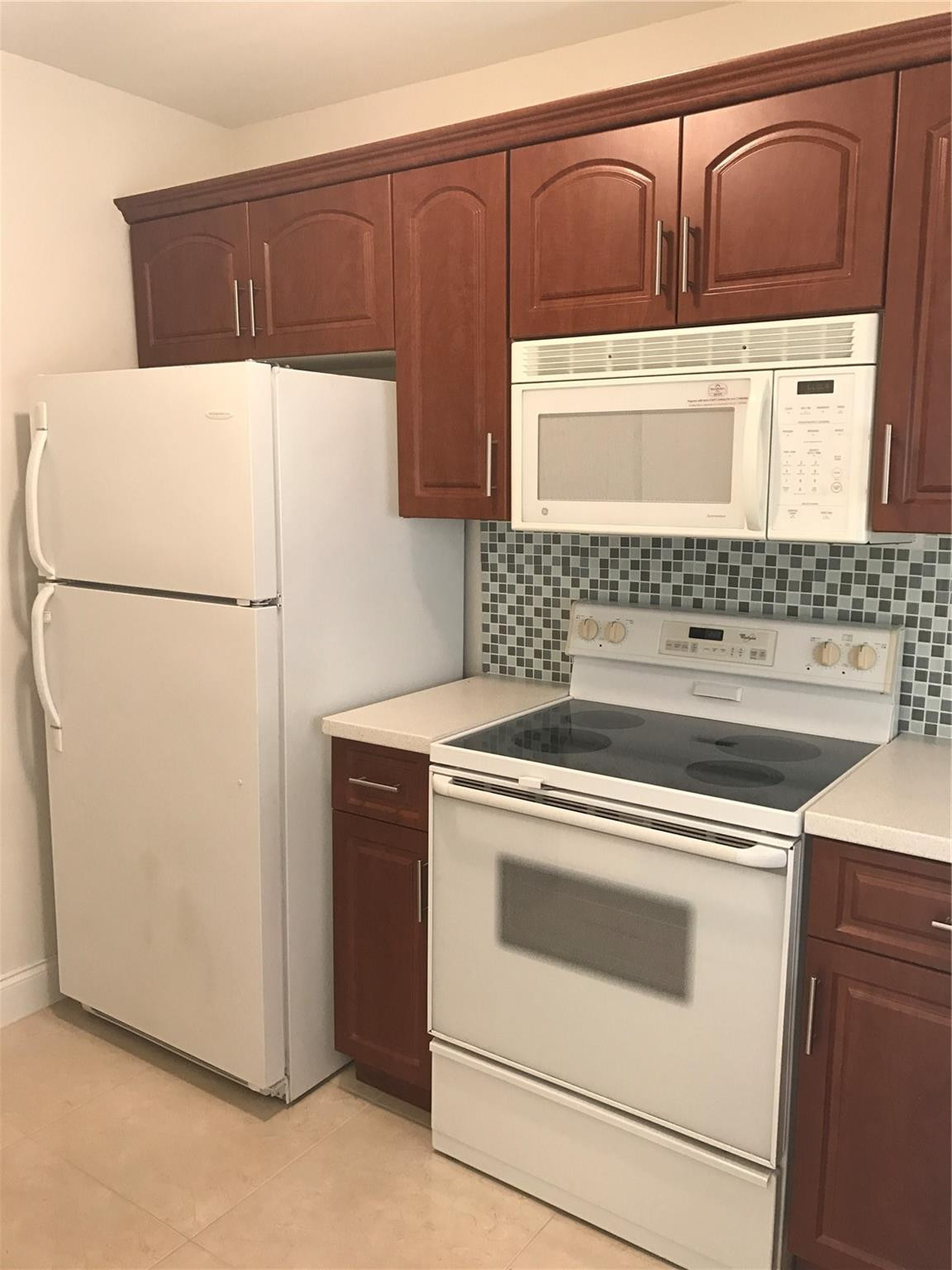 10053 Winding Lake Road, Unit 104 Sunrise, FL 33351 - Photo 4 of 44 a utility room with dryer and washer