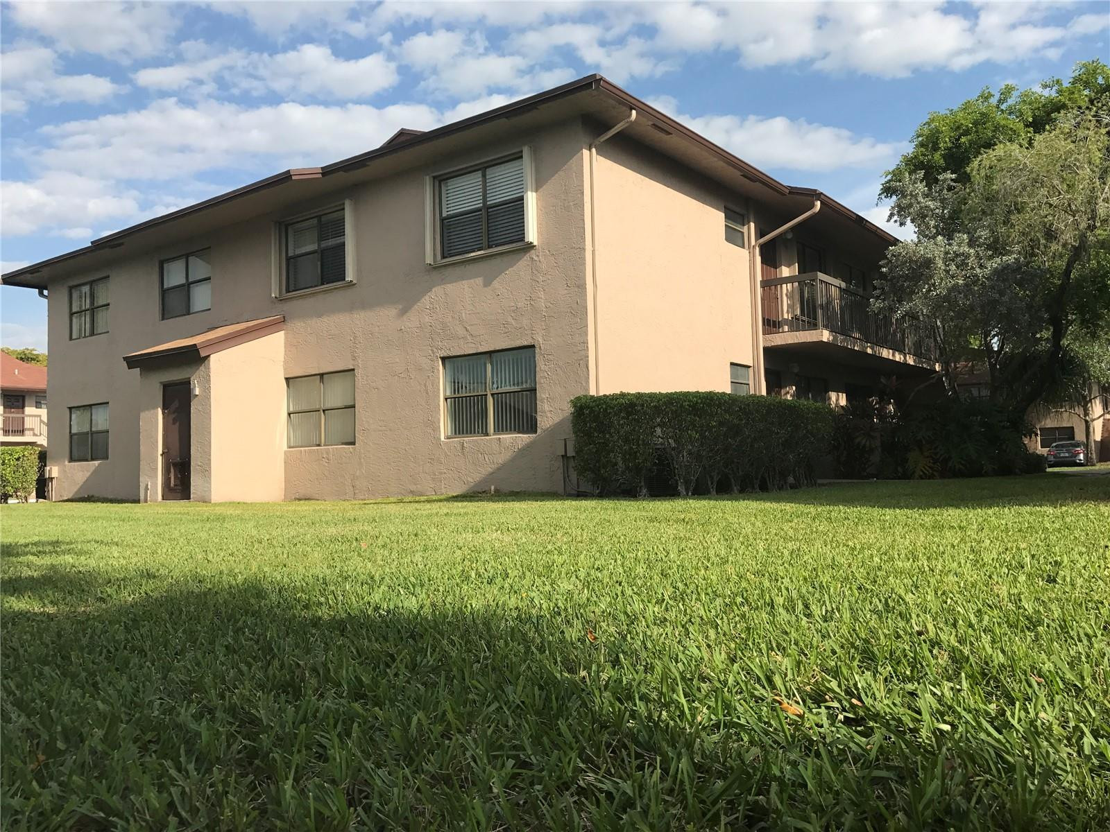 10053 Winding Lake Road, Unit 104 Sunrise, FL 33351 - Photo 44 of 44 a house view with a garden space