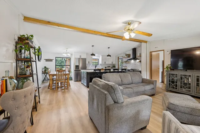 a kitchen with a sink a window and cabinets
