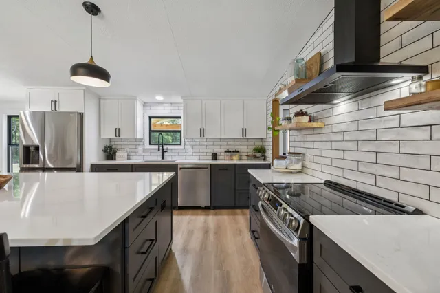 a bedroom with bed and wooden floor